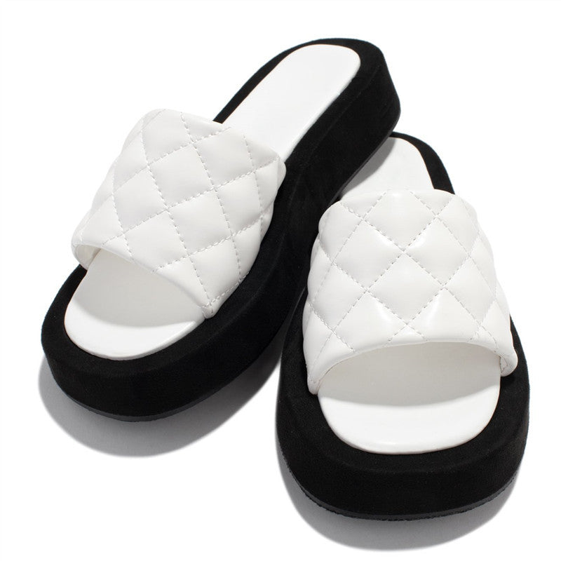 Dame mode slippers med quiltet overdel og høj plateau Stilla