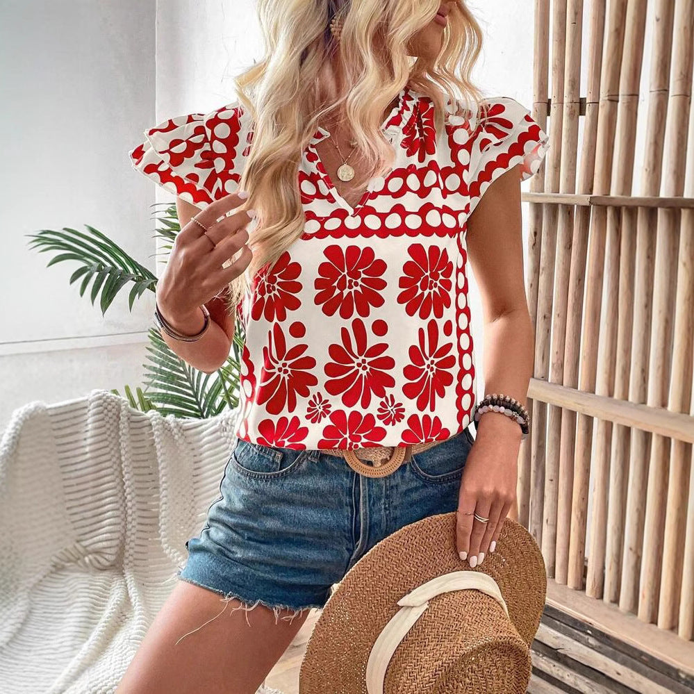 Damebluse med florale flæsedetaljer og frisk design Stilla