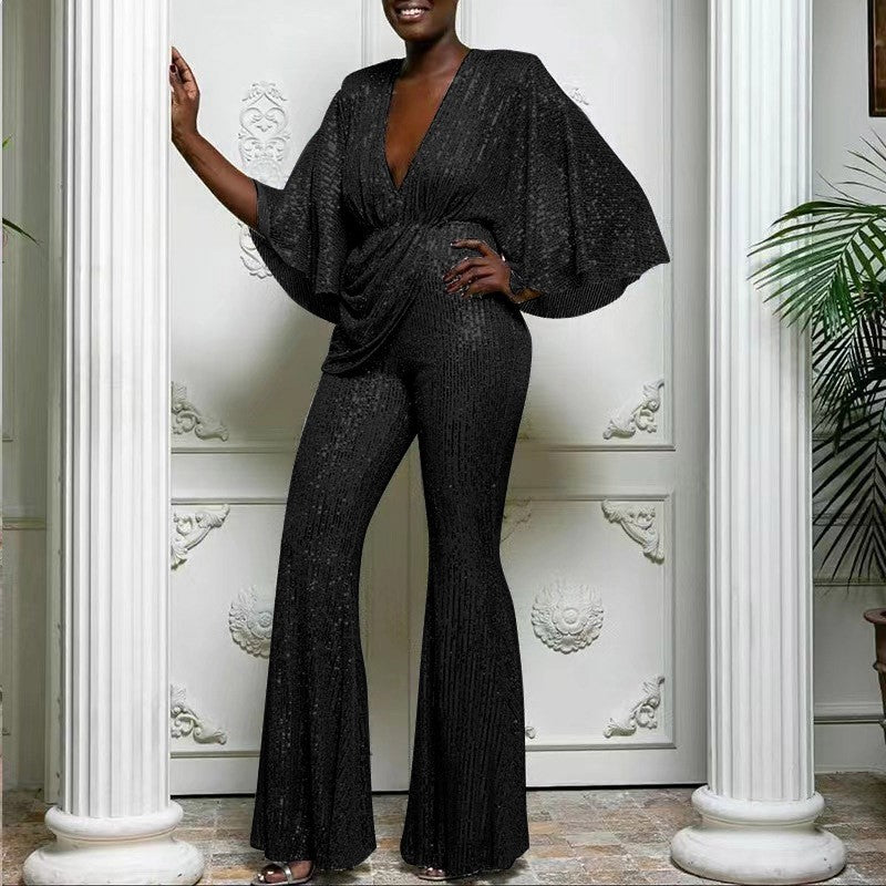 Dame glamourøs jumpsuit med glitrende paletter og vidde ben Stilla