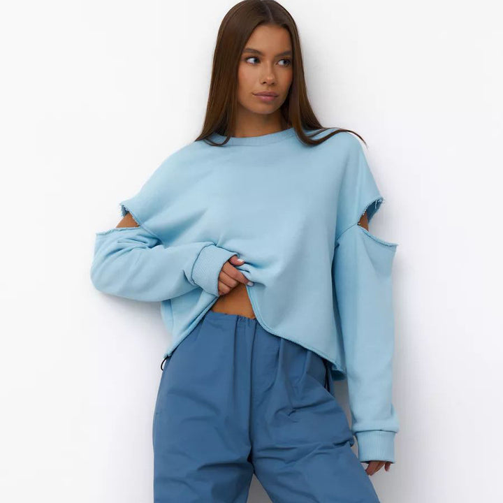 Dame afslappet sweatshirt med asymmetrisk cut-out-detaljer og oversized snit Stilla