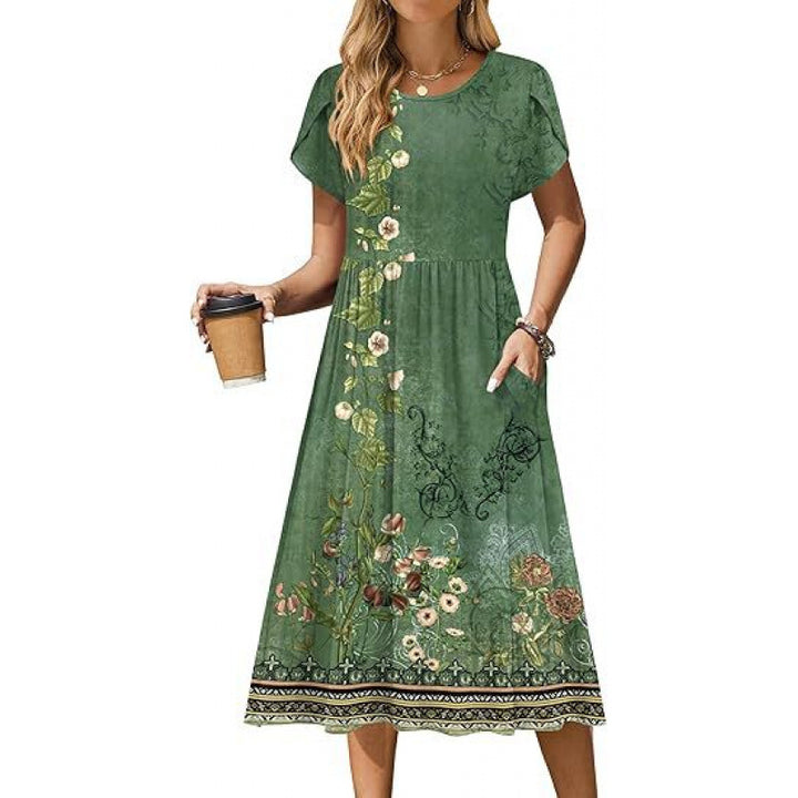 Dame flydende maxikjole med blomsterdesign og praktiske sidelommer Stilla