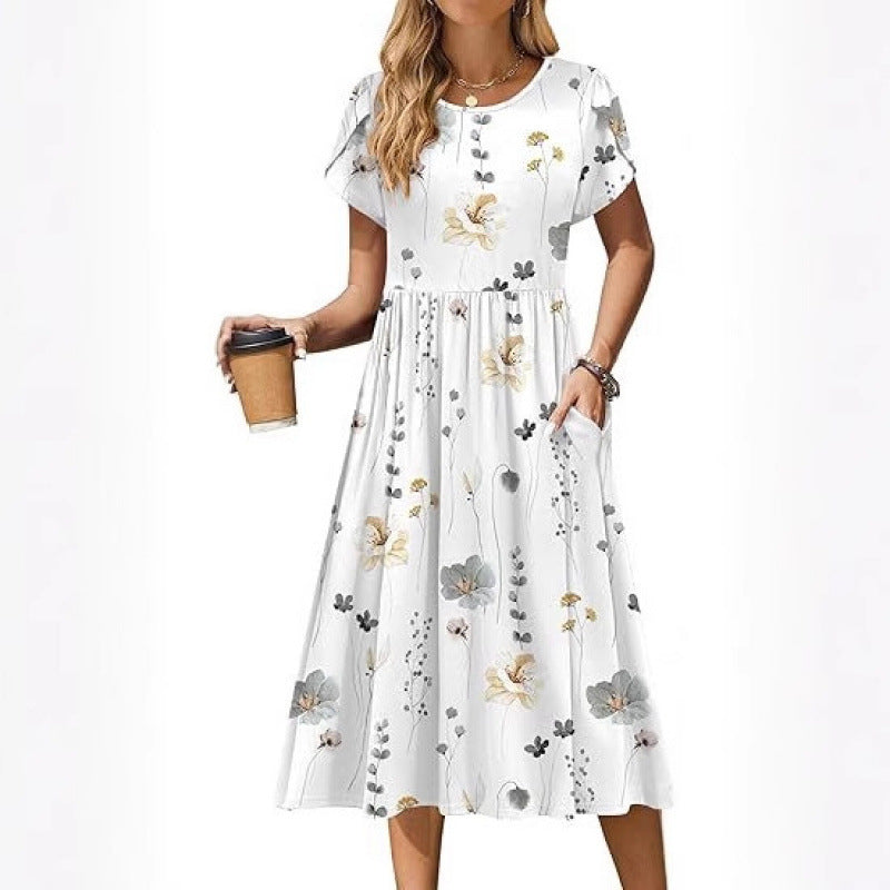 Dame flydende maxikjole med blomsterdesign og praktiske sidelommer Stilla