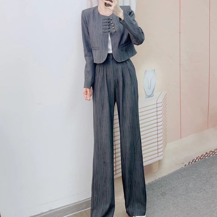 Dame Elegant Blazer-Bukser-Kombination med struktureret design og moderne knapdetaljer Stilla