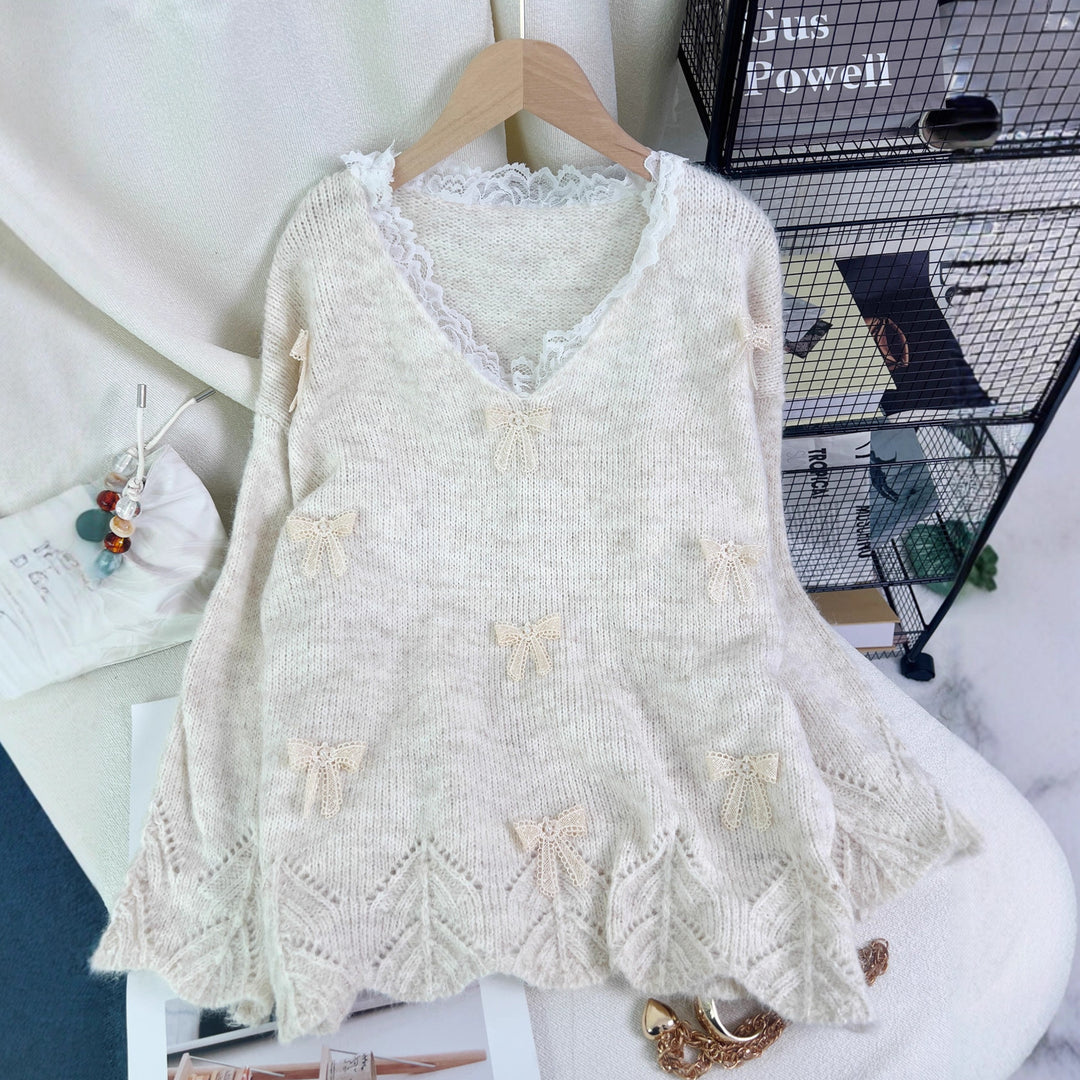 Damers fashionable striktrøje med legende sløjfeapplikationer Stilla