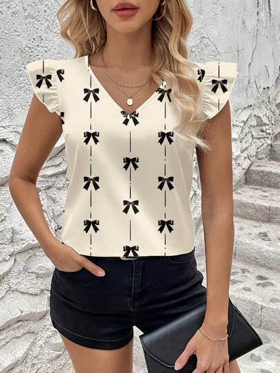 Dame blusenshirt med flæsedetaljer og legende sløjfemønster Stilla