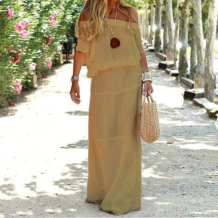 Dame Off-Shoulder Maxikjole med flydende snit og elegante volangdetaljer Stilla