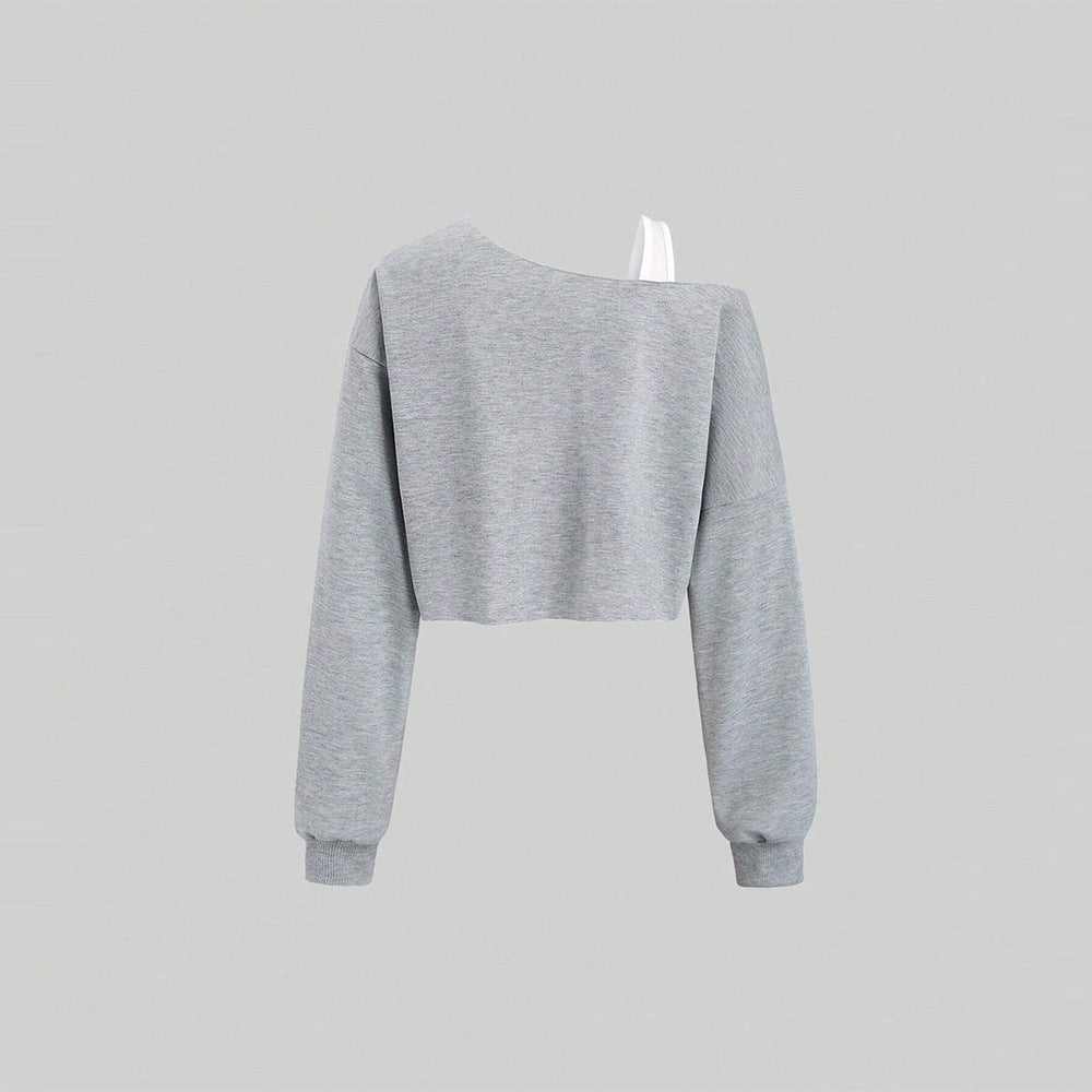 Kvindernes cropped sweatshirt med asymmetrisk design og voluminøse ærmer Stilla