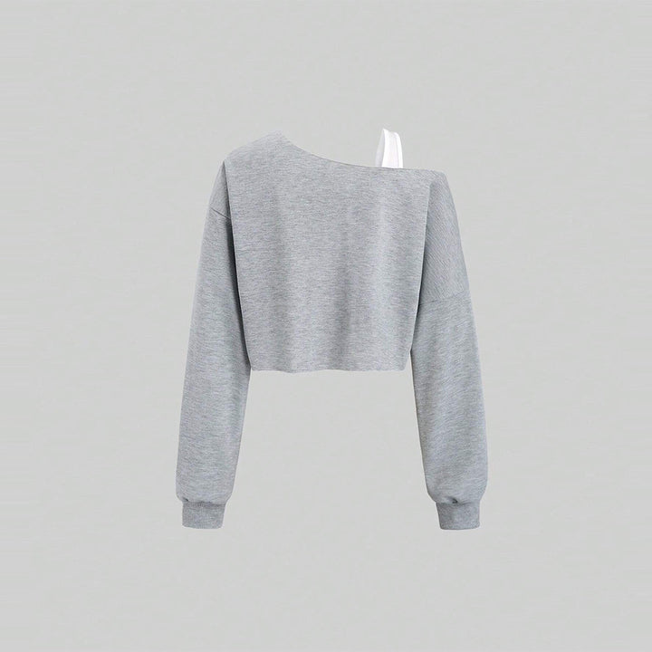 Kvindernes cropped sweatshirt med asymmetrisk design og voluminøse ærmer Stilla