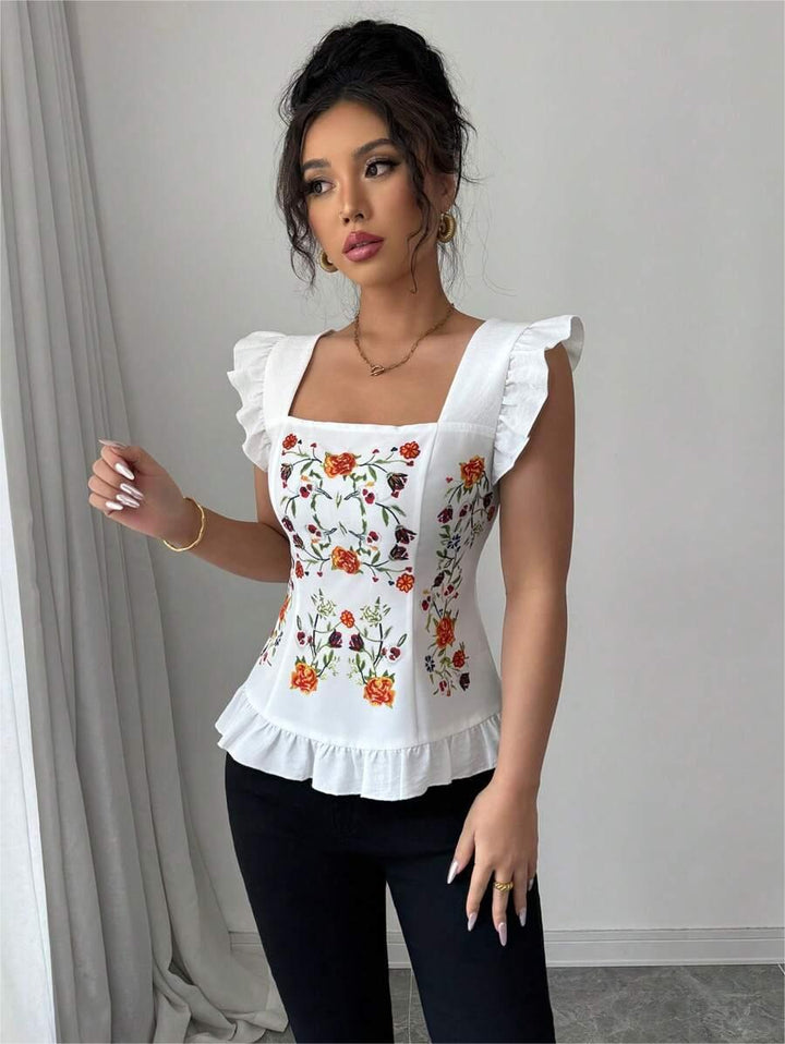 Damebluse med blomster broderier og flæse detaljer Stilla