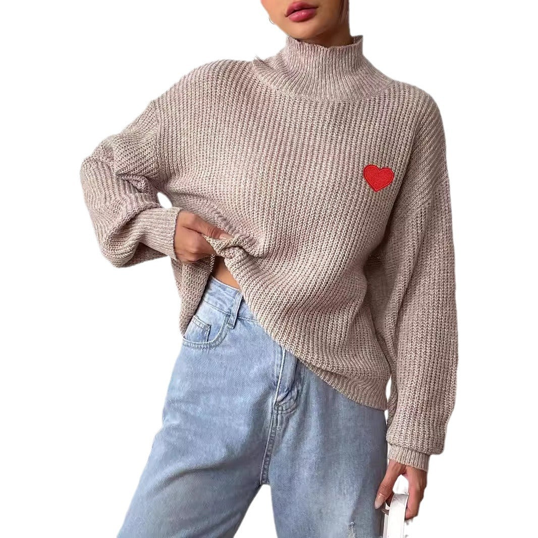 Dame rullekrave sweater med hjerteapplikation og løs pasform Stilla