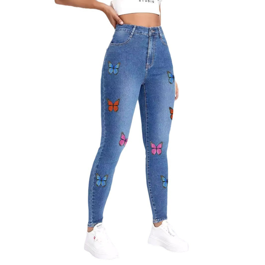 Dame Skinny Jeans med farverige sommerfugleapplikationer Stilla