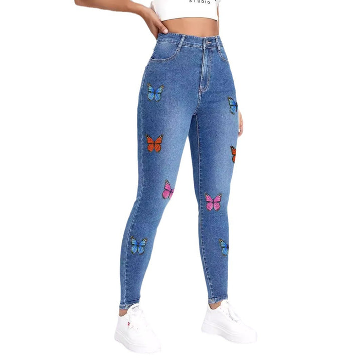 Dame Skinny Jeans med farverige sommerfugleapplikationer Stilla