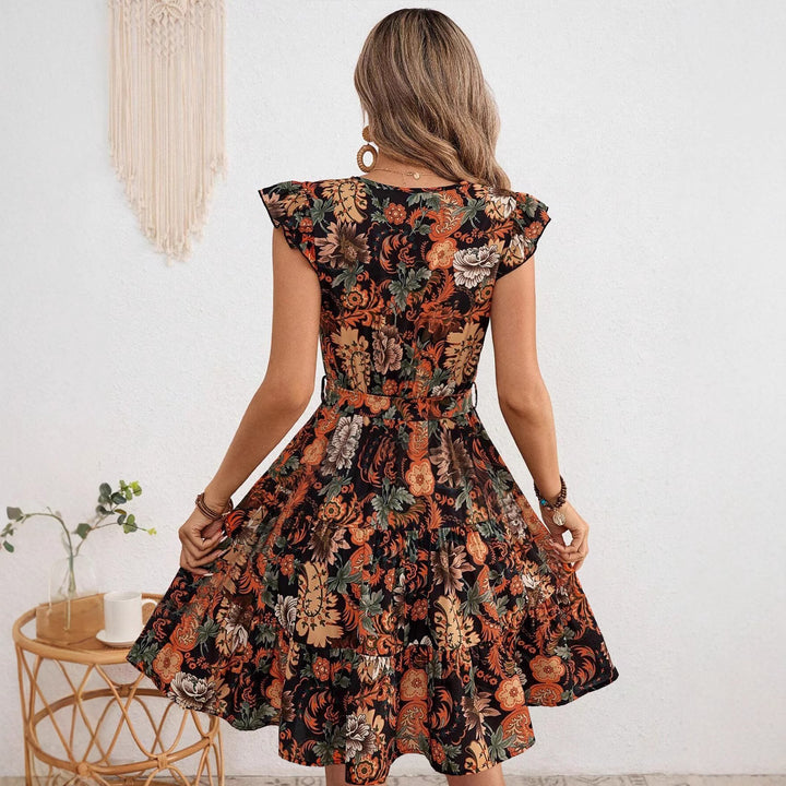 Dame wrap dress med voluminøse flæsedetaljer og blomster mønster Stilla