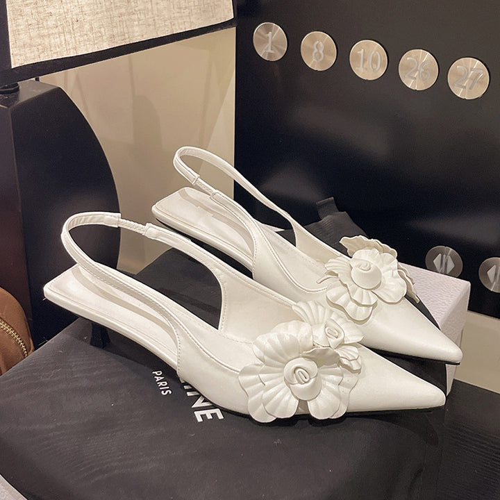 Dame Slingback-pumps med florale applikationer og elegant design Stilla