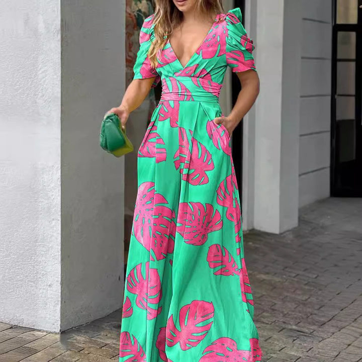 Femme Tropical Print Maxi Kjole med flatterende Vikkel-design Stilla