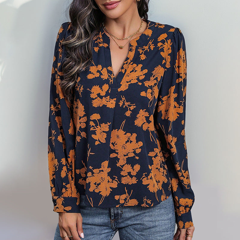 Damebluse med blomstertryk og elegante pufærmer Stilla