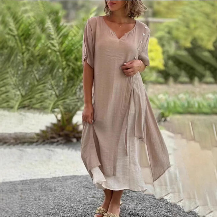 Dame Strandkjole med asymmetrisk snit og elegante knapdetaljer Stilla
