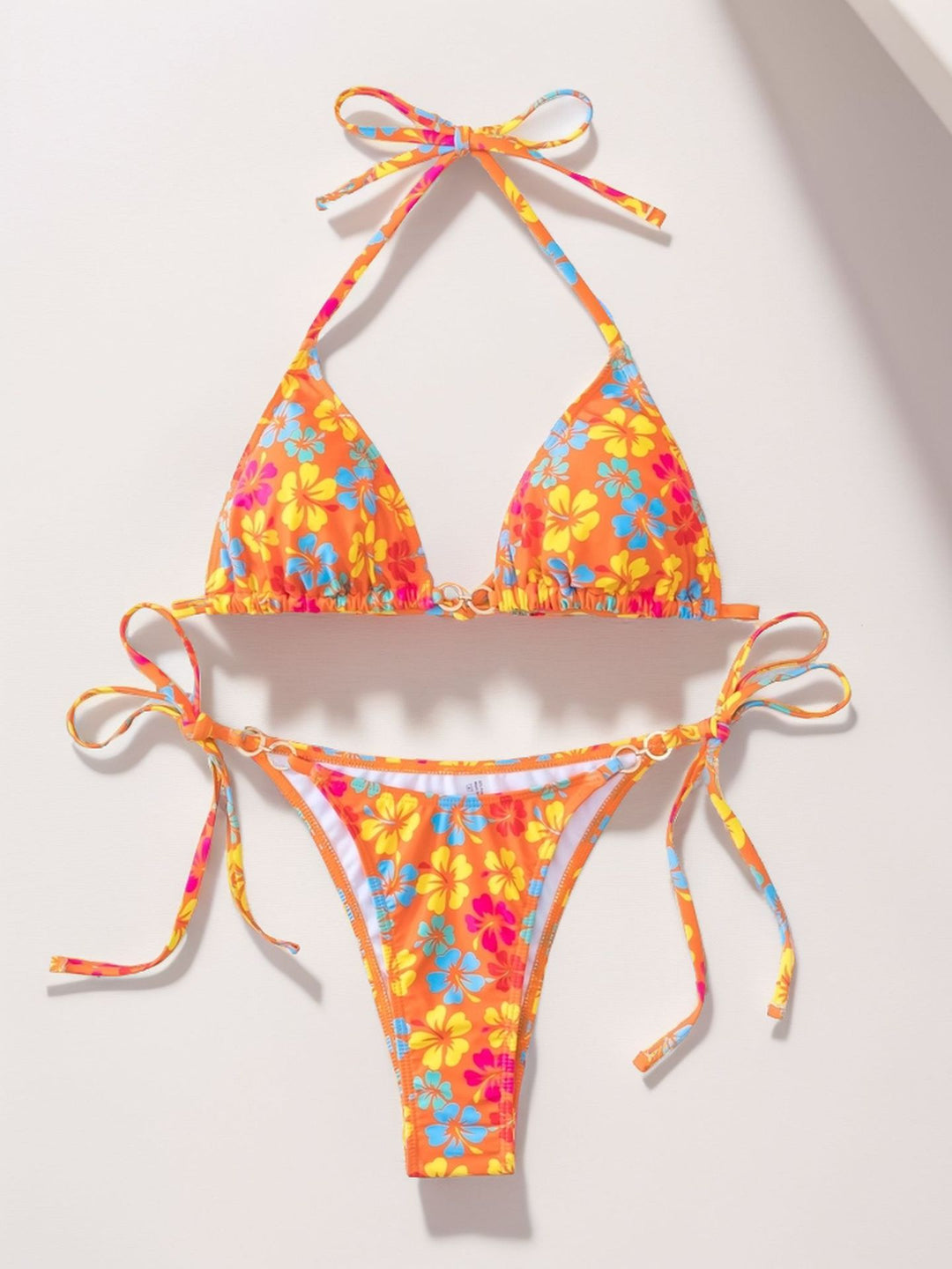 Dame triangel-bikini med alsidigt bindingssystem og livligt blomstermotiv Stilla