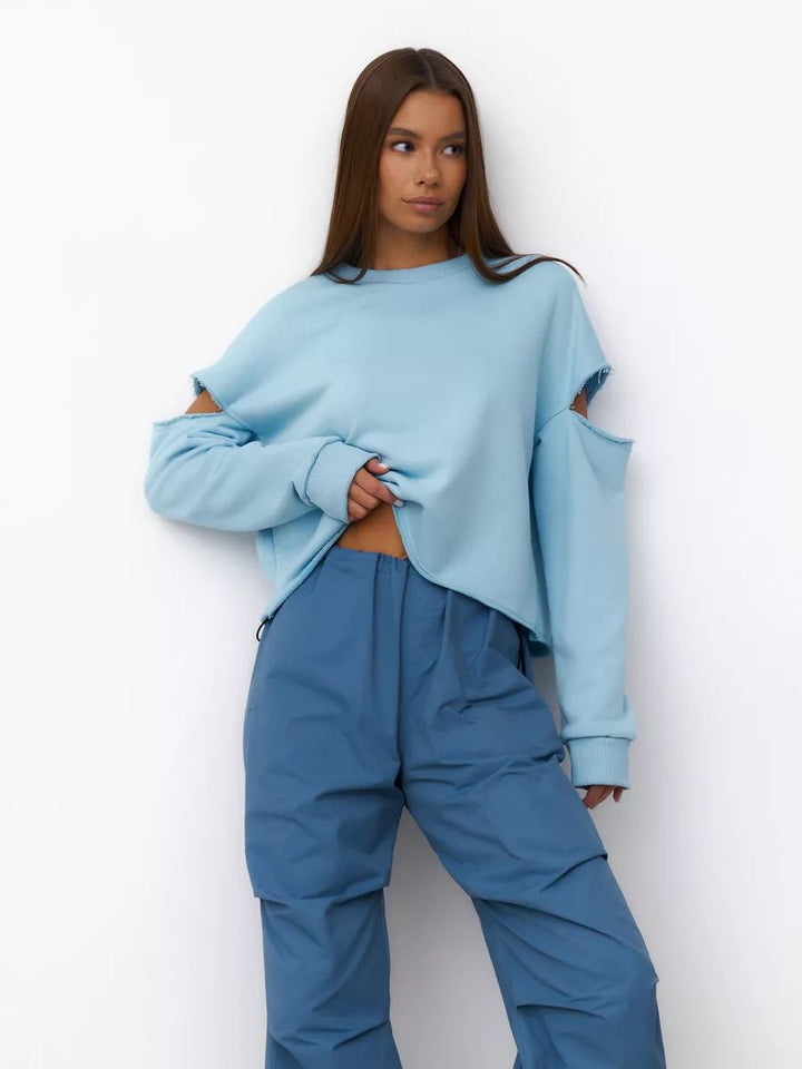 Dame afslappet sweatshirt med asymmetrisk cut-out-detaljer og oversized snit Stilla