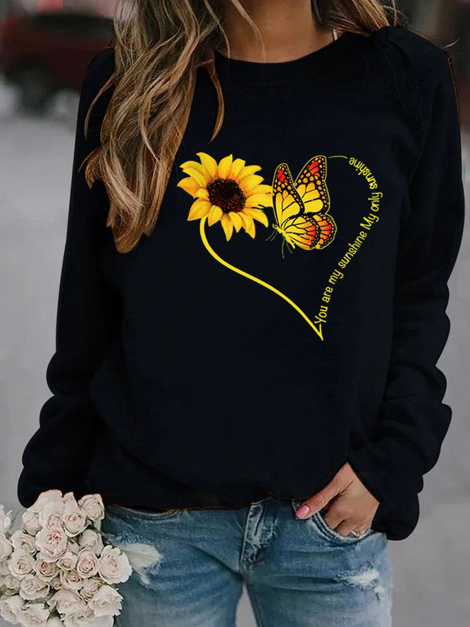 Kvinders sweatshirt med grafisk sommerfugl og solskinsmotiv Stilla