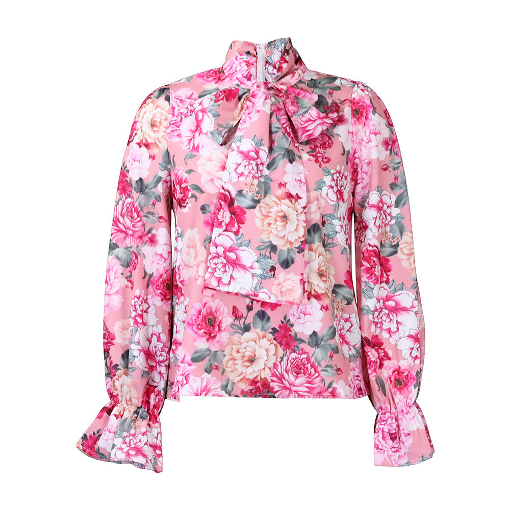 Damebluse med elegant sløjfekrage og blomsterdesigns Stilla