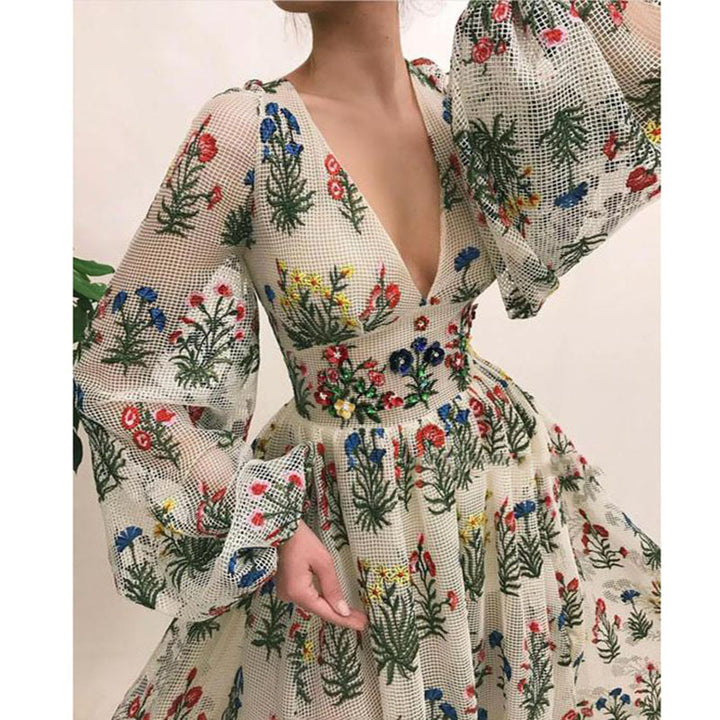 Dame maxikjole med blomsterprint og svajende ærmer Stilla