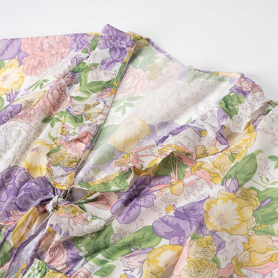 Dameviklekjole med blomsterdesign og flæsedetaljer Stilla