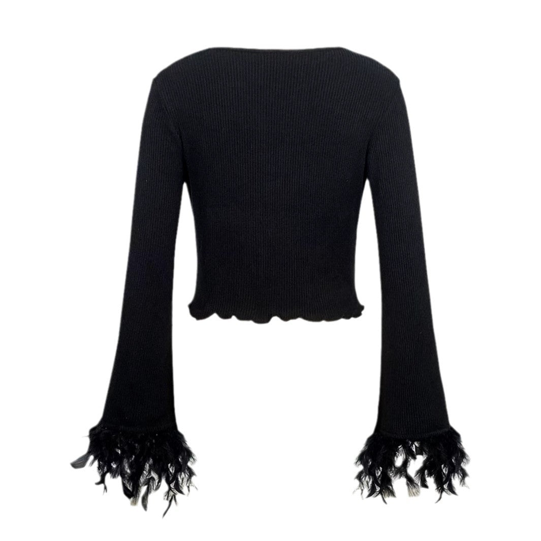 Dame moderigtig crop-pullover med raffinerede fjer på ærmerne Stilla