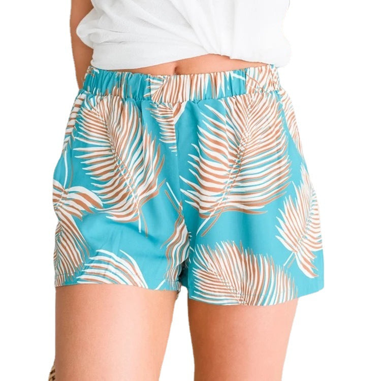 Kvinders lette strandshorts med elastisk talje og tropisk bladdesign