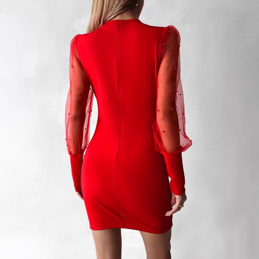 Dame wrap kjole med elegante gennemsigtige ærmer og skinnende detalje Skovae