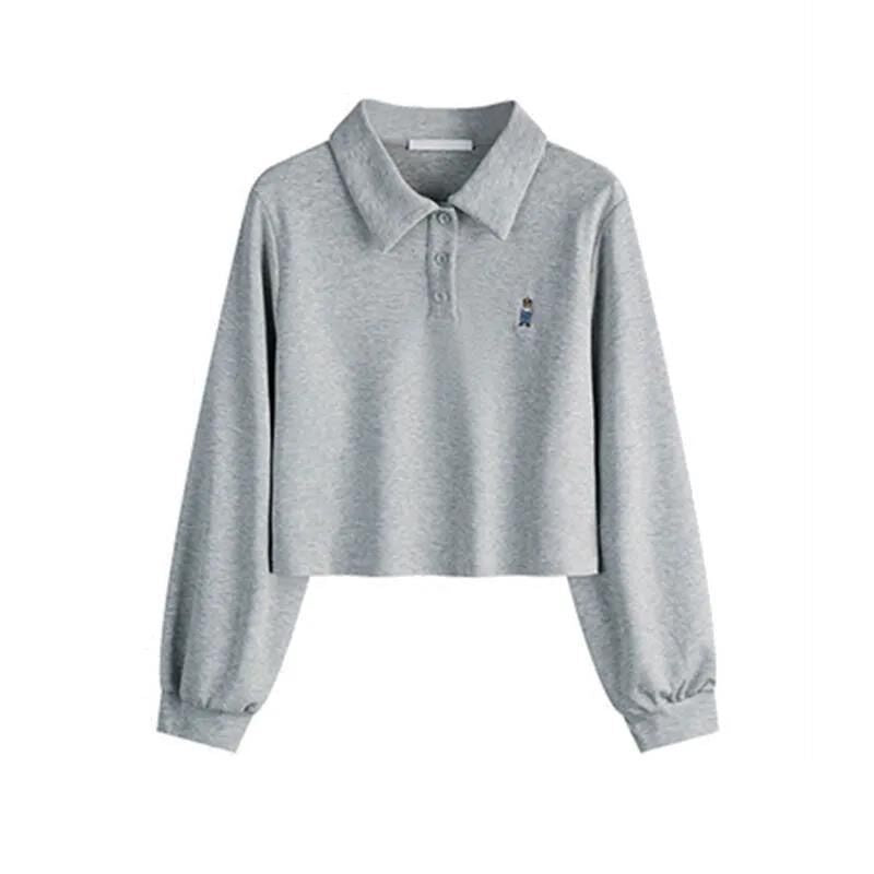 Dame skåret langærmet polo-top med stilfuld broderi Stilla