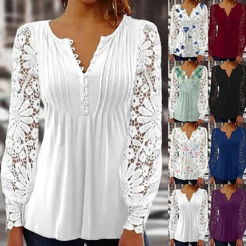 Damer spidsbluse med elegante knapdetaljer og voluminøse ærmer Stilla
