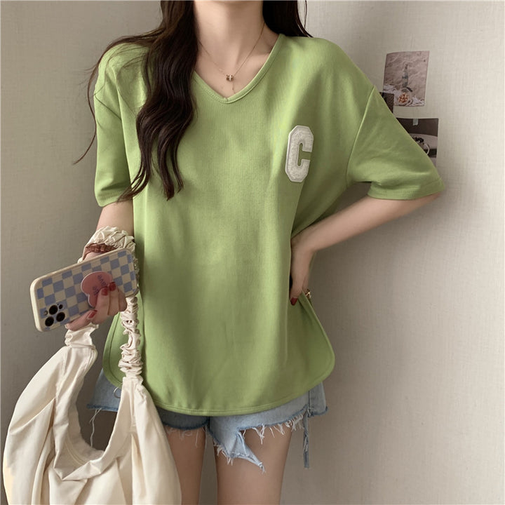 Femme Oversized V-Hals Grafik T-Shirt med Sideslids Stilla