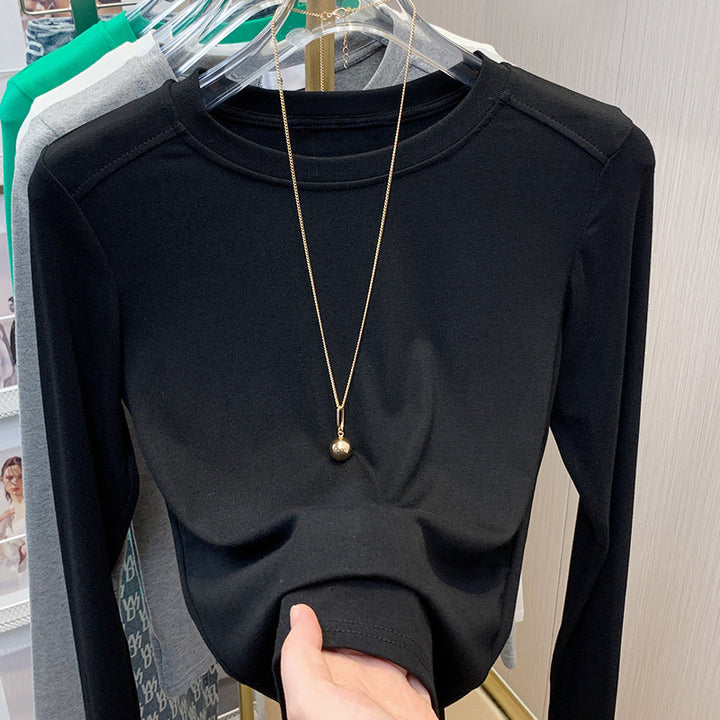 Dame Elegant og tætsiddende Langærmet T-shirt med Rundhalsetud Stilla