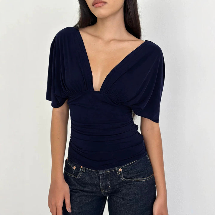 Dame Elegant top med dyb V-udskæring og afslappet draperingsdesign Skovae