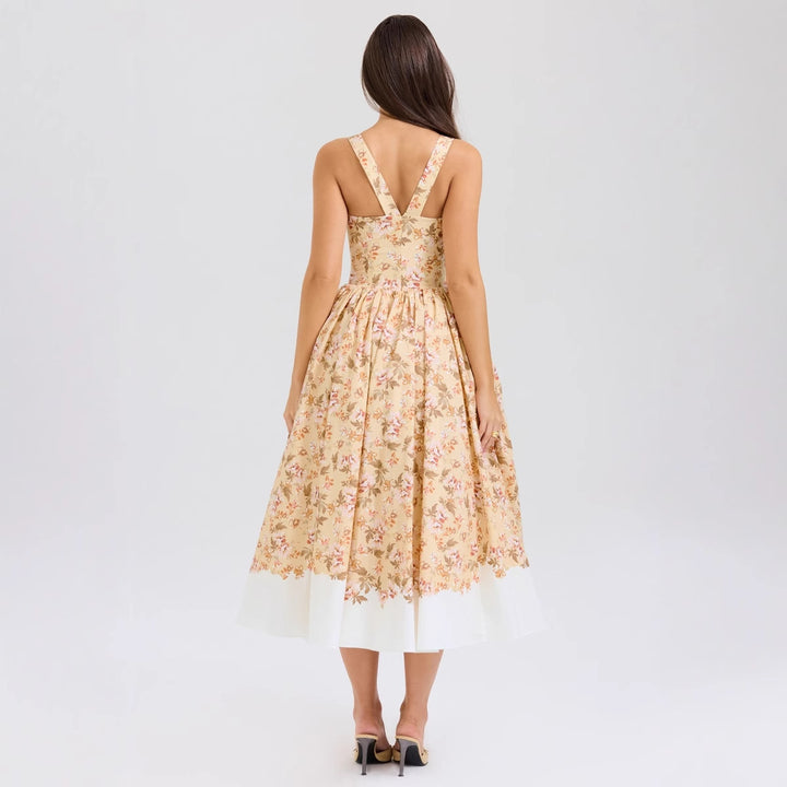 Dame Midikjole i vintage-stil med blomstertryk og svajende skørt Stilla