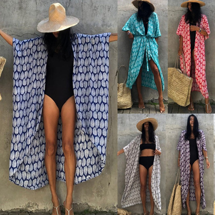 Dame strandkimono med luftigt snit og festligt bladdesign Stilla