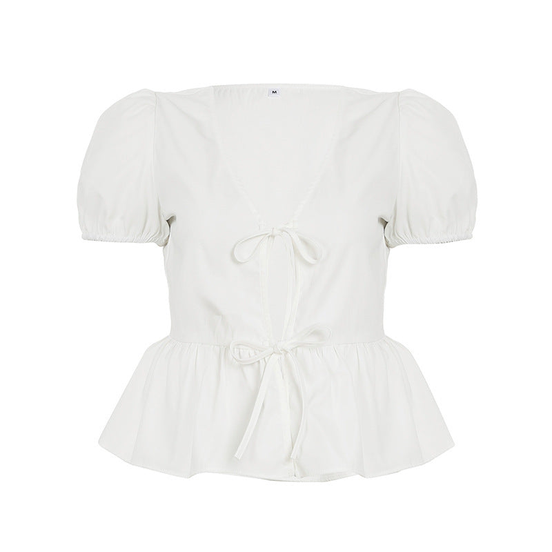 Dame indpakningsbluse med puffærmer og feminin peplum-kant Skovae