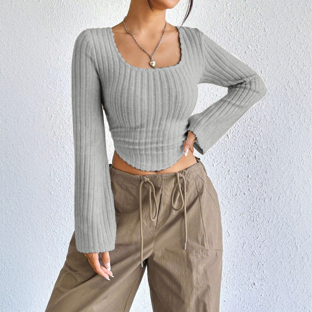 Kvinders langærmet crop top med dekorativ ribdesignet og afrundet bund Stilla