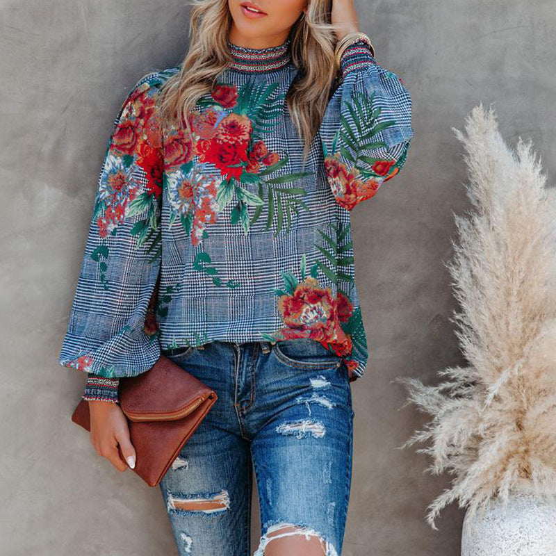 Damer modebluse med puffærmer og blomstret design Stilla