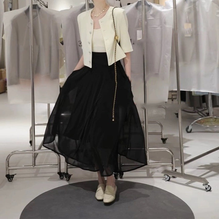 Dame elegant kort jakke med struktureret design og fashionable knapdetaljer Stilla
