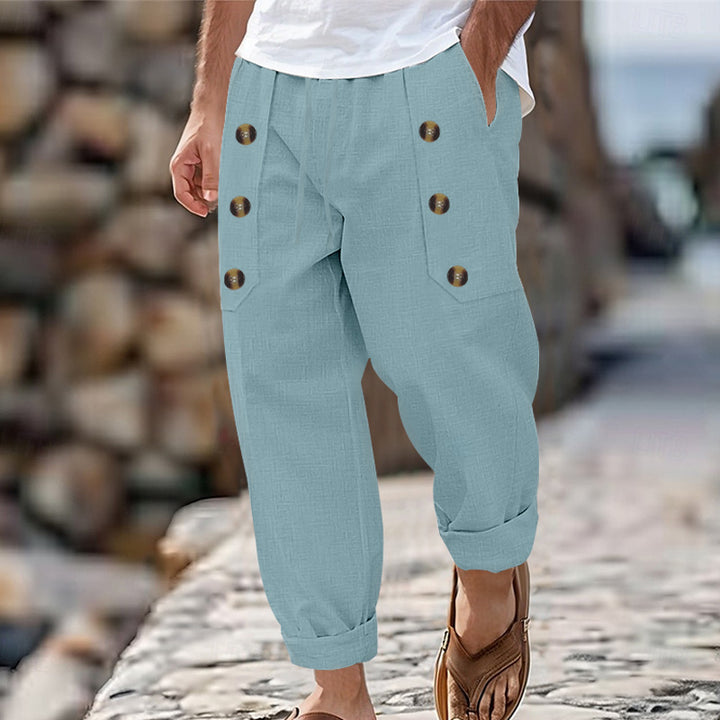Herren nan loose linen pants with decorative button stripes, rolled ankle hem and side pockets Skovae