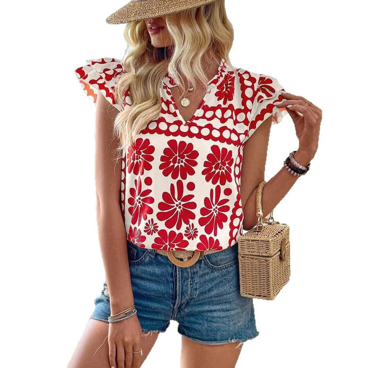 Damebluse med florale flæsedetaljer og frisk design Stilla