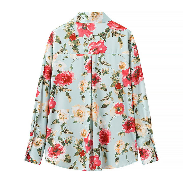 Damebluse med blomsterprint og elegant knapliste Stilla