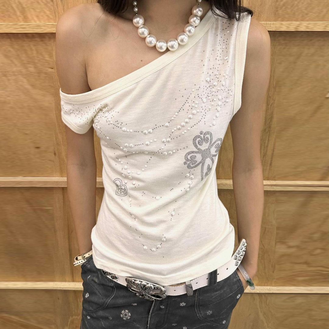 Dame top med off-shoulder design og funklende detaljer Skovae