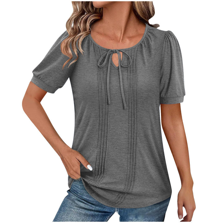 Damebluse med puffærmer og raffineret halterneck Stilla