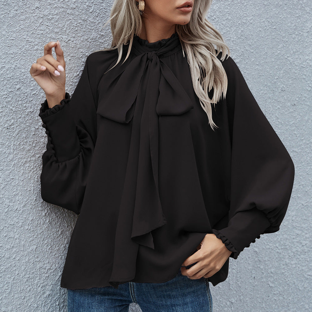 Damebluse med raffineret sløjfedetalje og elegant rund halsudskæring Stilla