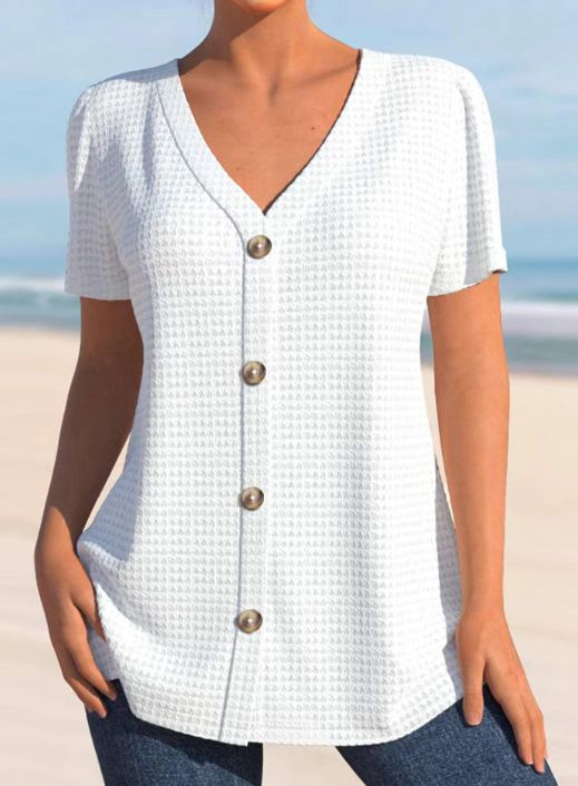 Dame kortærmet bluse med elegant knaplukning og struktureret design Stilla