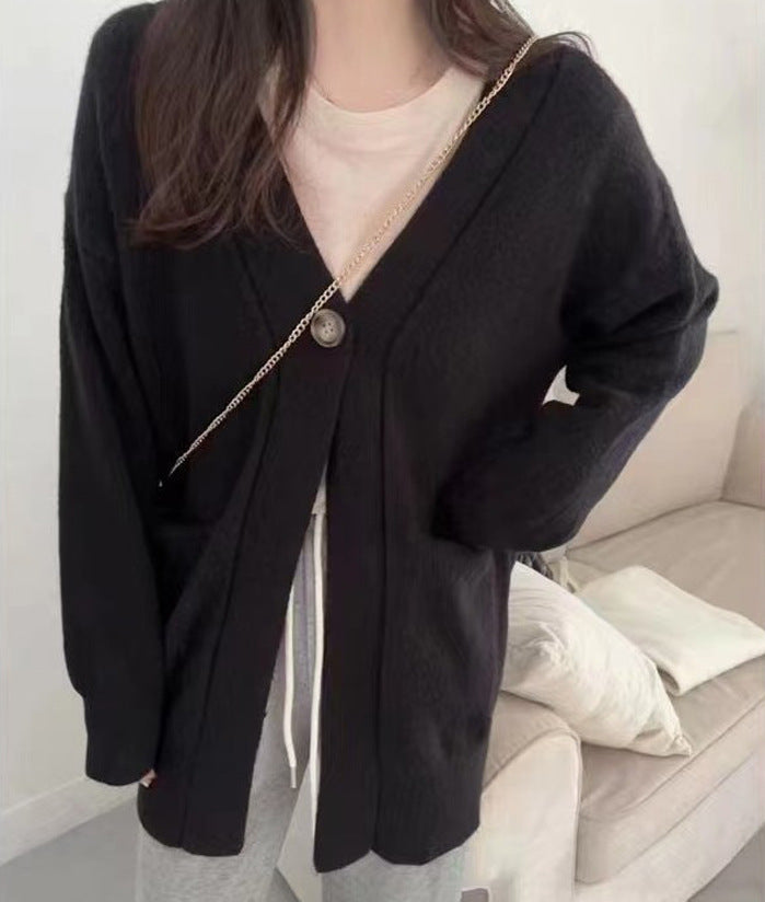 Dame Cozy Cardigan med en Løs Pasform og Lommer