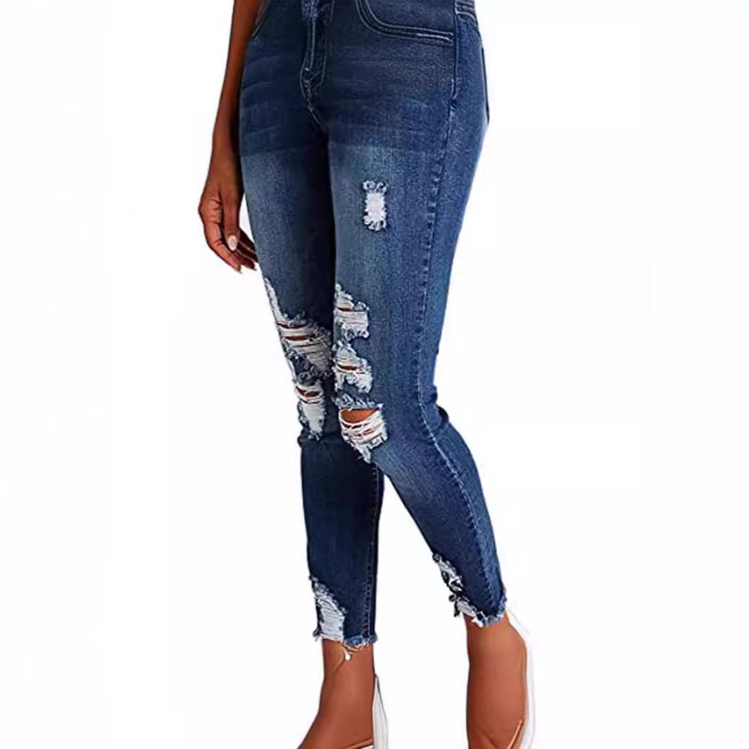 Dame Skinny Jeans med modetrend Destroyed-effekt og figurskærende snit Stilla